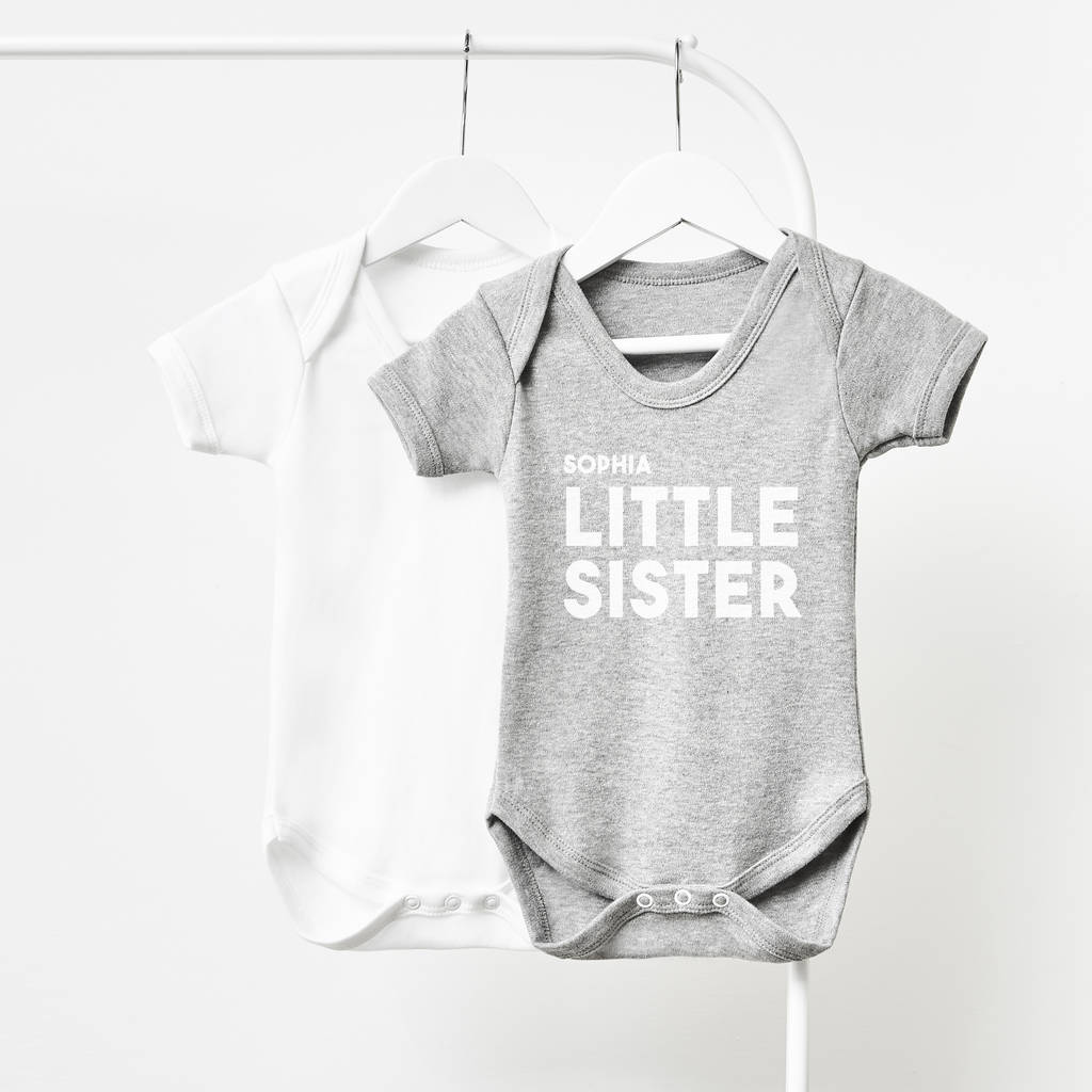 Little sister deals baby grow